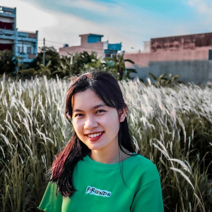 Kaveri Mehta, Lead Design Curator at CloverSpringWhim, reviewing corporate floral arrangements